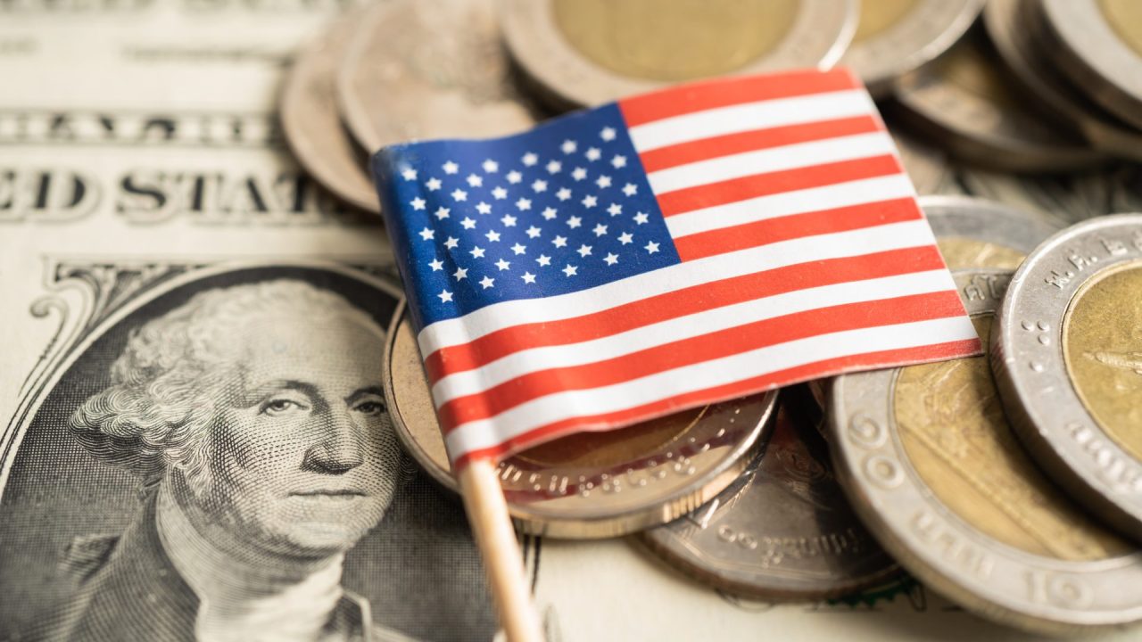 United States flag set on top of currency